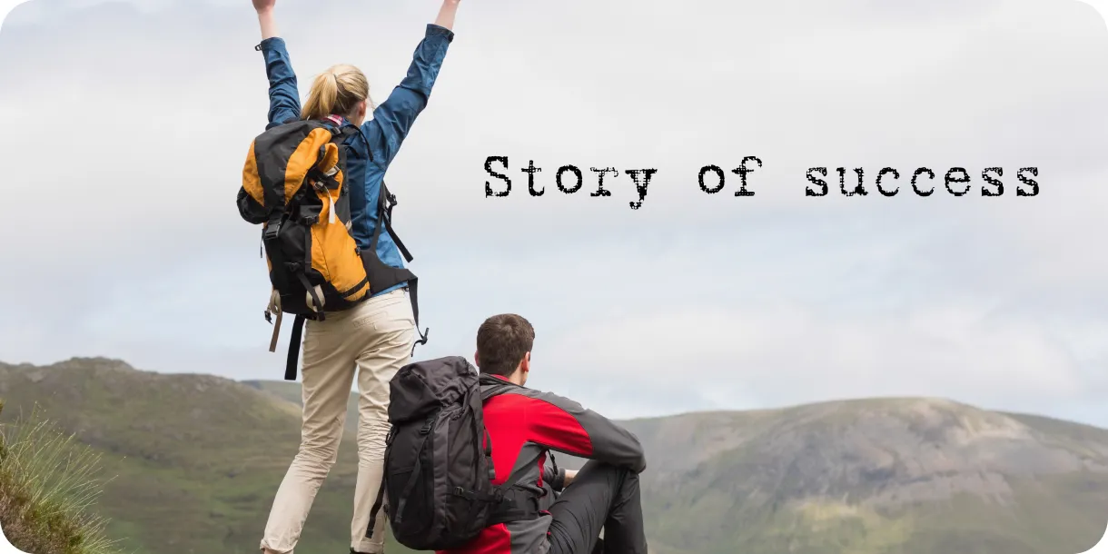 Two hikers celebrating at a mountain summit next to the words "Story of success"