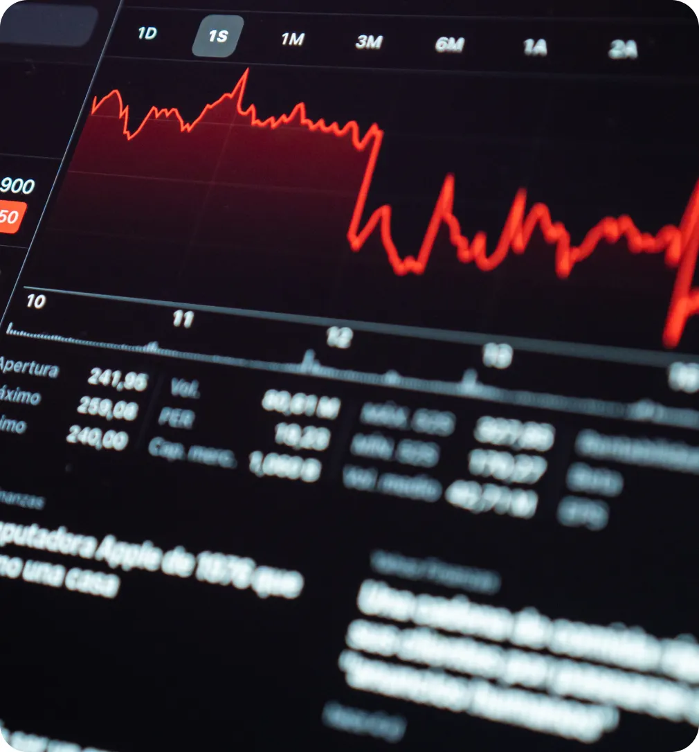 A trading terminal showing a red forex price chart and market data