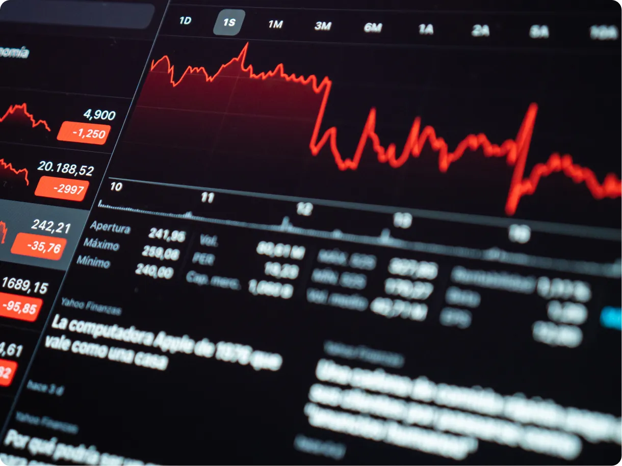 A trading terminal showing a red forex price chart and market data