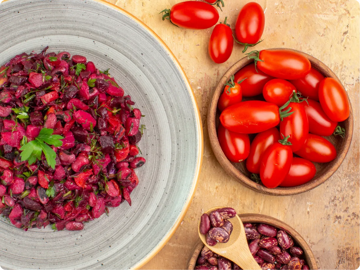 A bowl of fresh Nutra ingredients and tomatoes on a table