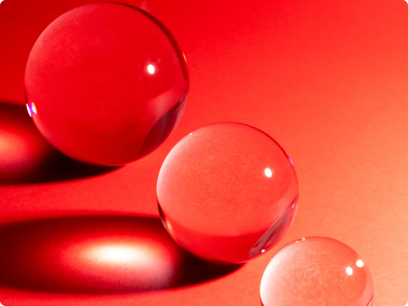 Close-up of glossy red spheres representing Nutra products