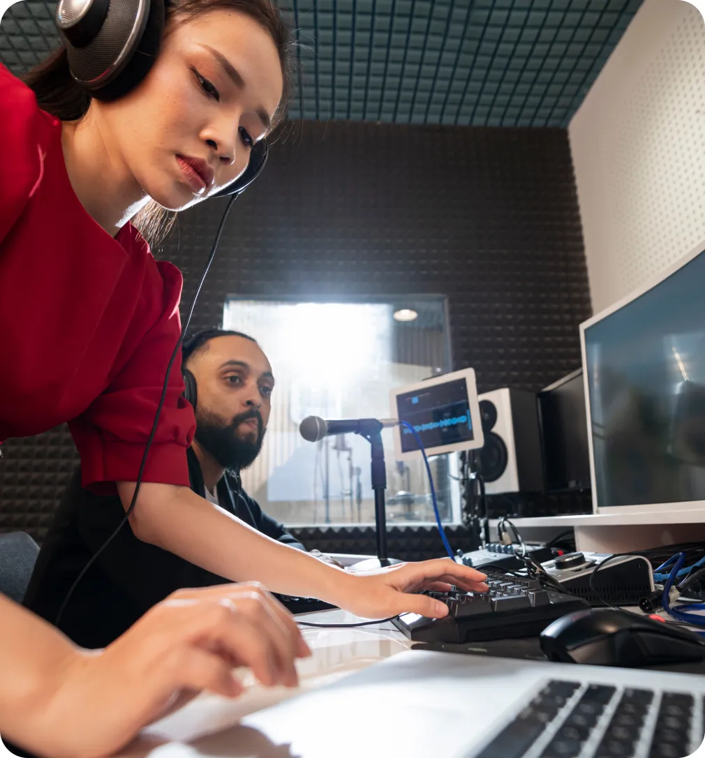 A media buyer launching a software campaign at a multi-monitor desk